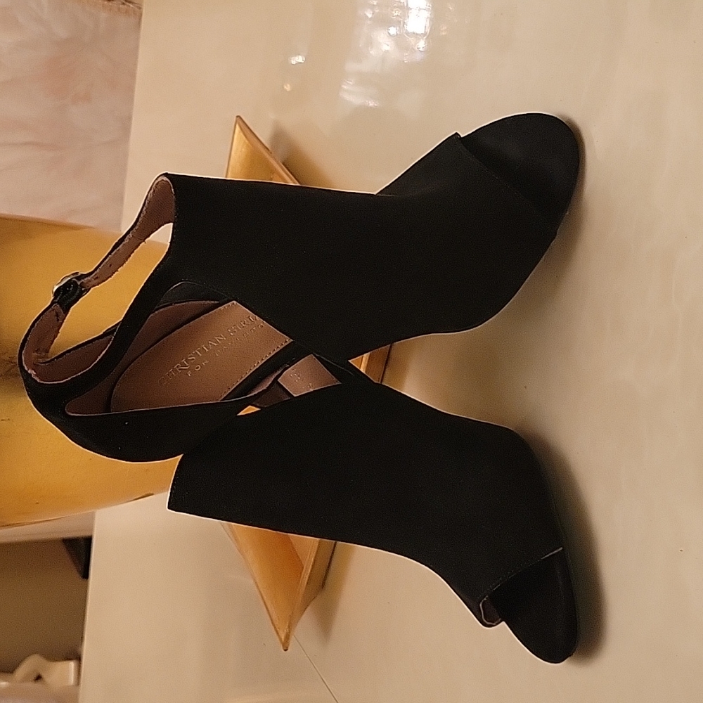 Christian Siriano black suede peep toe side buckle four inch heels. Size 8.5